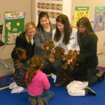 A mix of professors and students using the teddy bear clinic.