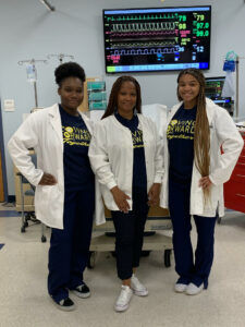 Nursing students in their lab coats.