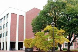 A four story red brick building. 